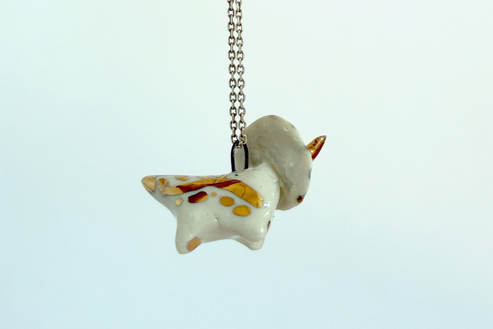 Alternative view of Ceramics & Gold Triceratops Pendant