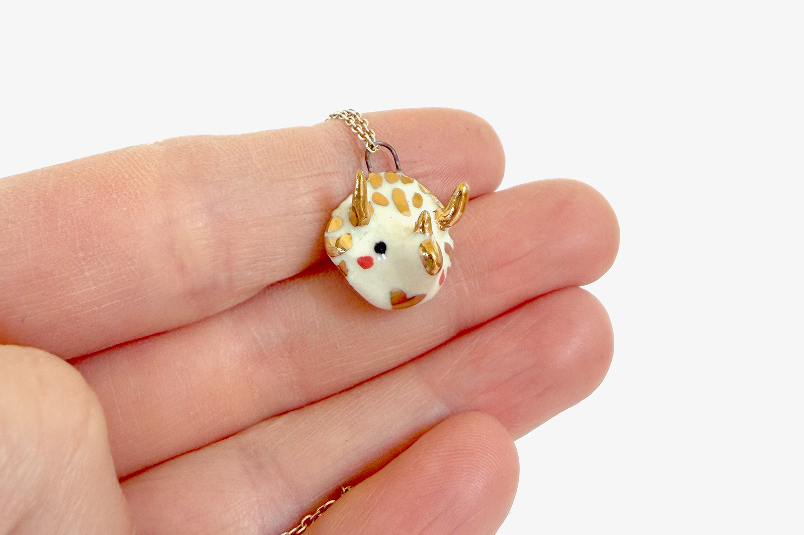 Porcelain and Gold Triceratops Pendant
