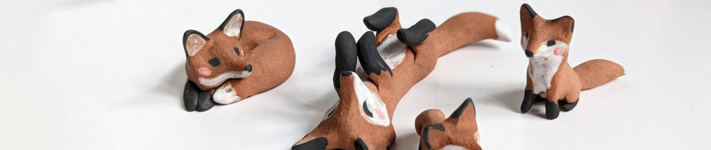 ceramic fox in red clay figurines 