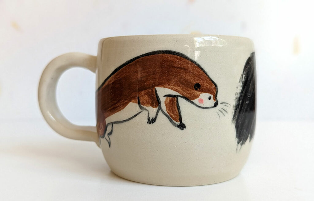 ant eater and otter mug