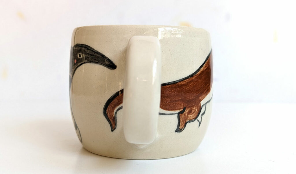 ant eater and otter mug