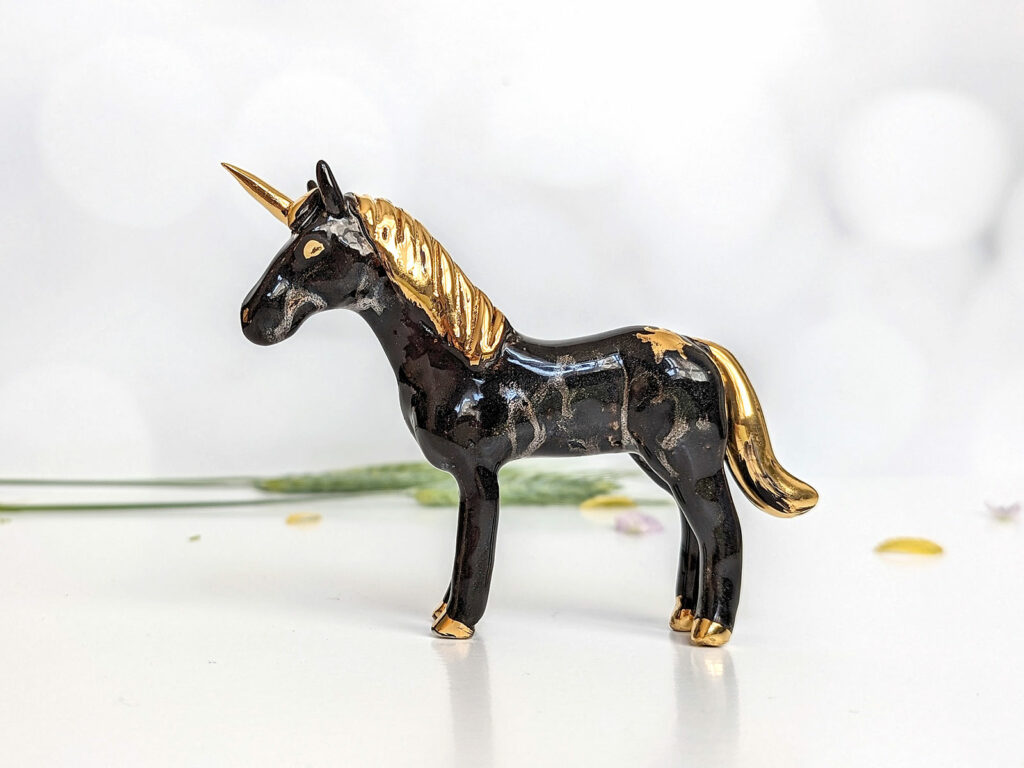 Night and gold unicorn figurine