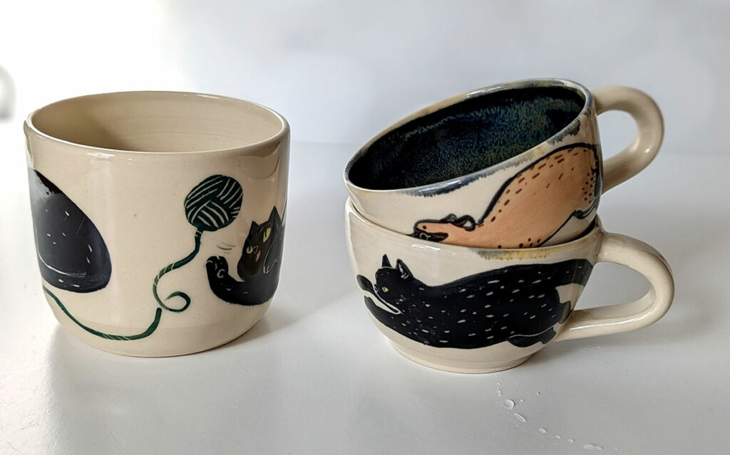 set of two tea cups and a cup