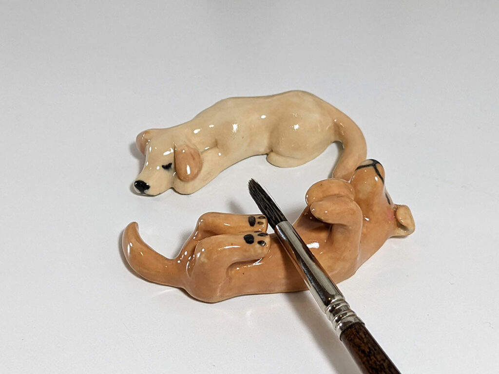 dog figurines as brush rests